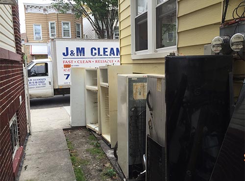 Removing Unwanted appliances from driveway in New York City (before)